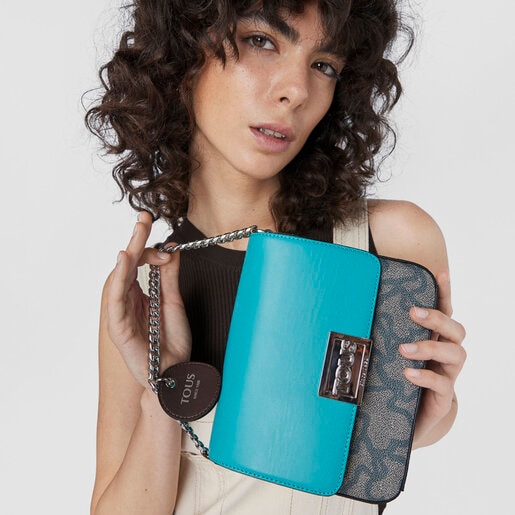 ブラック＆ターコイズカラーのスモールクロスボディバッグ Kaos Legacy