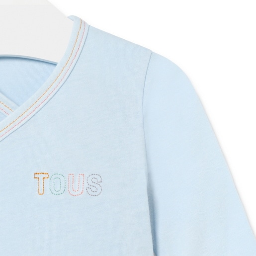 Camiseta de bebé cruzada lisa celeste