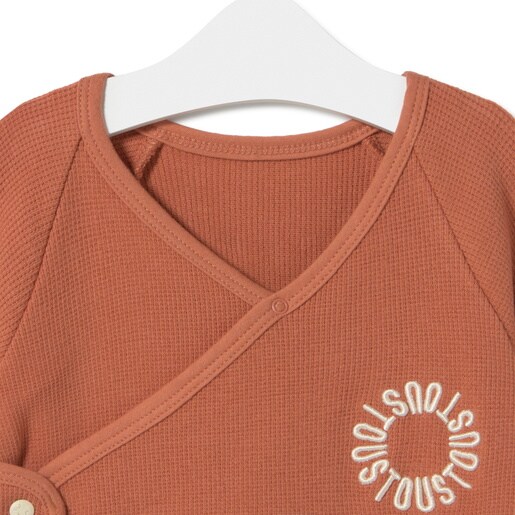 Wrap-over baby playsuit in Classic brick red