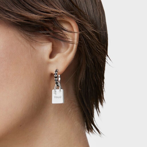 Single silver earring with motif Medallions