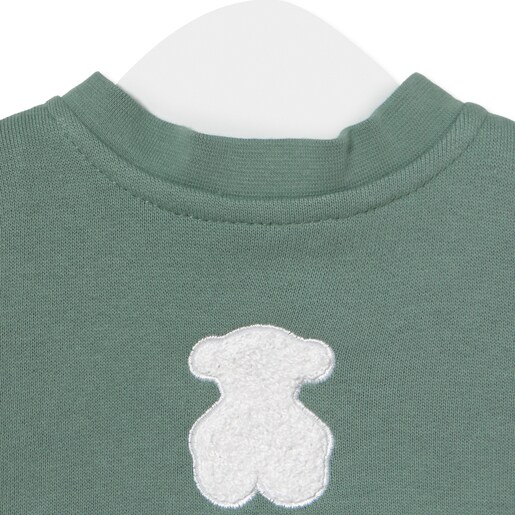 Baby bodysuit with smock in Soft green