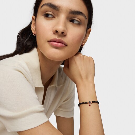 Pulsera con baño de oro rosa 18 kt sobre plata, espinelas y ónix facetado motivo oso Motif