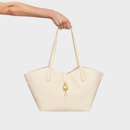 حقيبة أحمال خفيفة متوسطة الحجم من الجلد باللون البيج من تشكيلة TOUS MANIFESTO