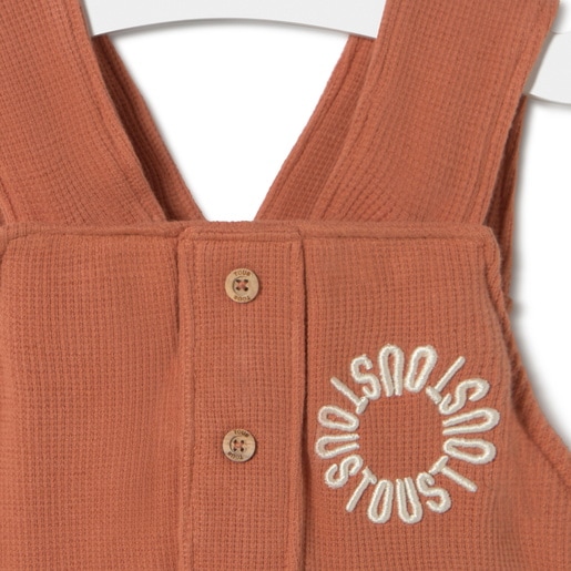 Piqué fabric baby romper in Classic brick red