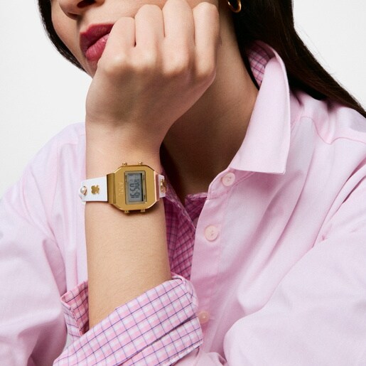 ساعة رقمية بحزام باللون الأبيض، وهيكل من الصُلب باللون الذهبي، ومرصعة بالأحجار الكريمة من تشكيلة TOUS XPRESURSLF.