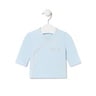 Camiseta de bebé cruzada lisa celeste