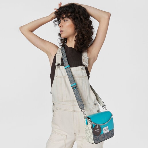 ブラック＆ターコイズカラーのスモールクロスボディバッグ Kaos Legacy