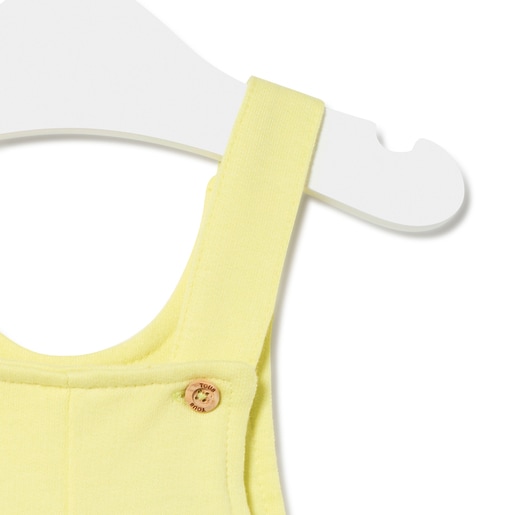 Dungarees-style baby romper in Classic yellow