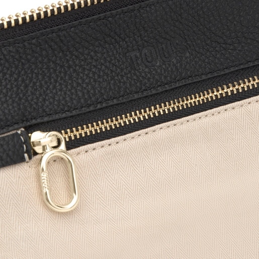 حقيبة بحزام يلتف حول الجسم باللون الأسود من تشكيلة TOUS Hold