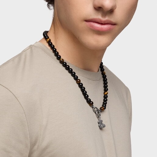 Silver necklace with onyx, tiger’s eye, and Hold Man rings