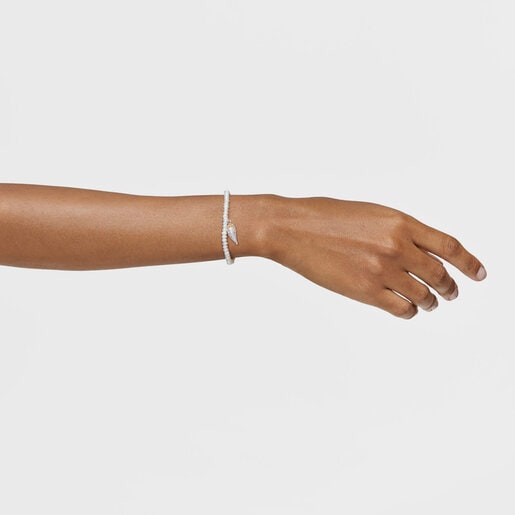 Yunque Elastic Bracelet with cultured pearls and two-tone charm